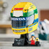 LEGO Ayrton Senna Helmet set 43024 features a yellow, green and blue brick-built racing helmet with Honda and Nacional logos, black display stand, plaque and minifigure.