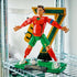 LEGO Cristiano Ronaldo soccer display features red, green, gold and black plastic brick construction forming a CR7 football figure with articulated limbs, soccer ball and showcase base in a room setting.