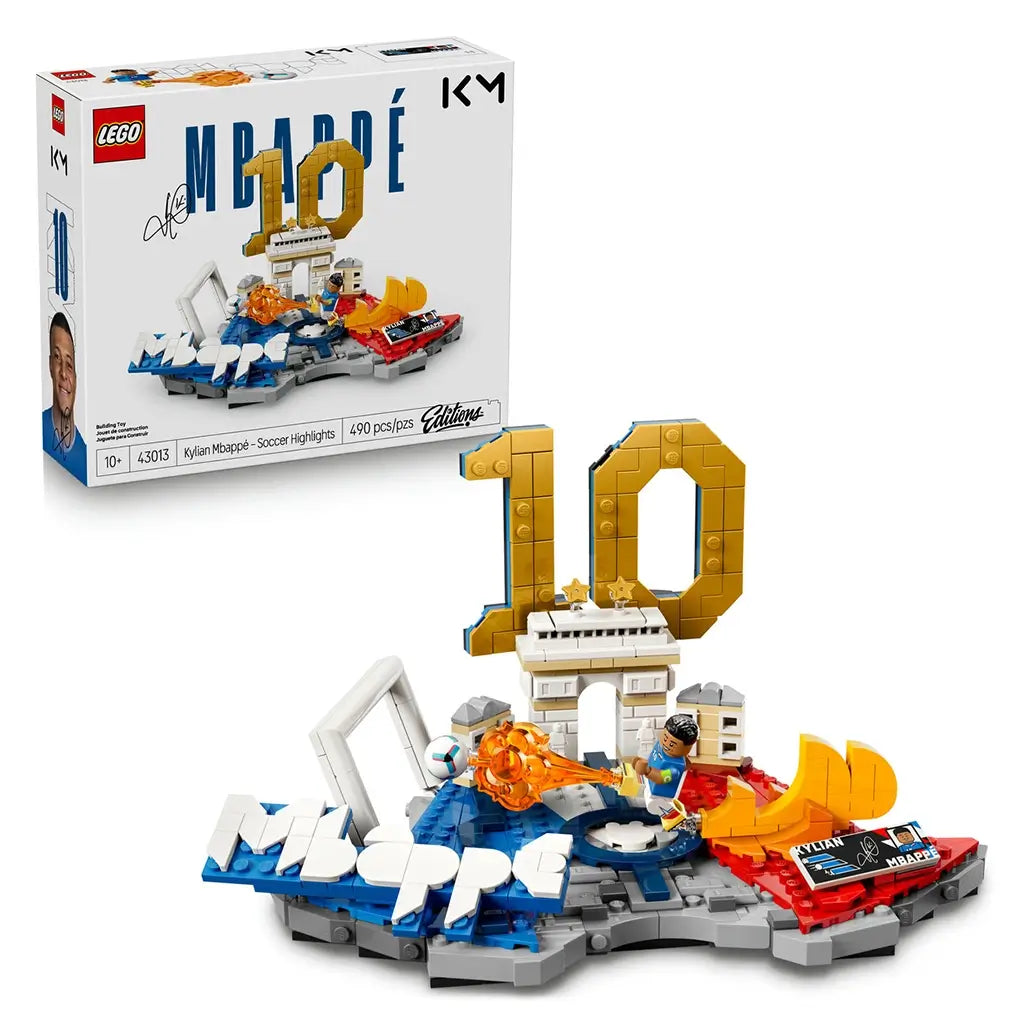 LEGO Kylian Mbappé soccer display features blue, white, gold and red plastic brick construction shaped as a football highlights scene with goal, Arc de Triomphe, number 10 and action minifigure on a decorative base.