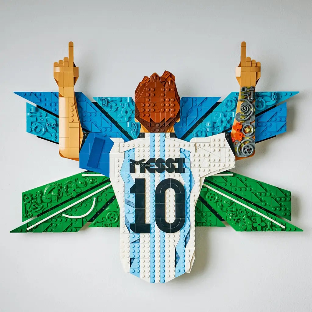 LEGO Lionel Messi wall art display features white, sky-blue and green textured plastic brick panels forming the iconic number 10 Argentina jersey celebration pose mounted on a clean interior wall.