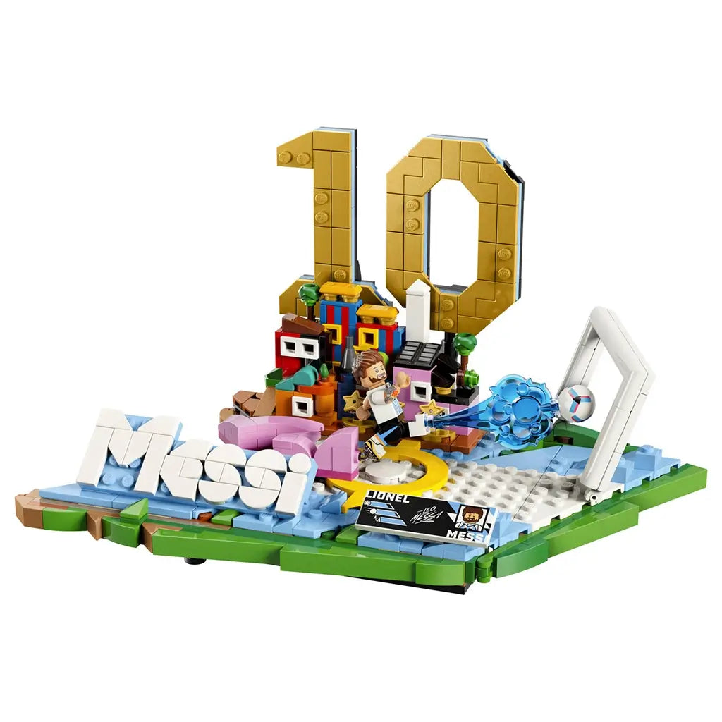 LEGO Lionel Messi soccer display built from blue, green, white and gold plastic bricks, featuring a number 10 tribute, football action scene, goal frame and nameplate on a plain studio background.