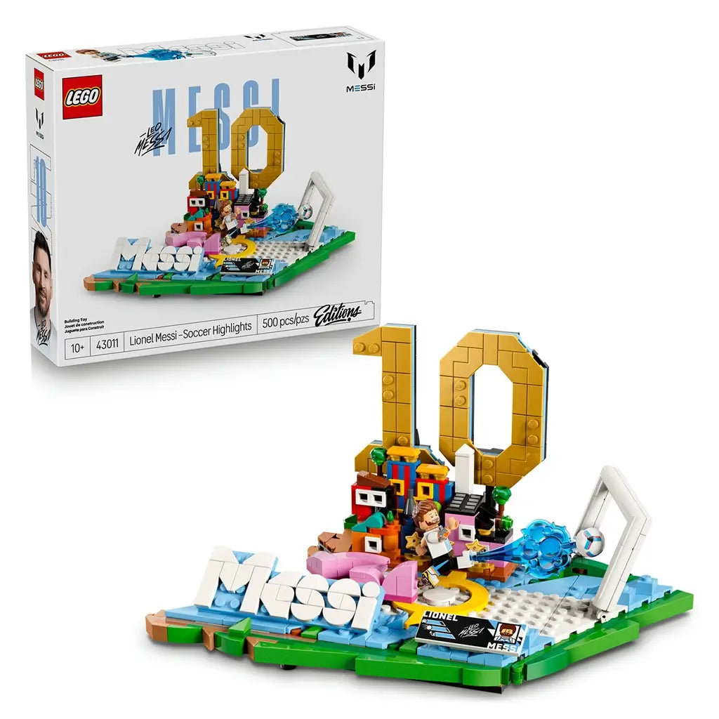 LEGO Lionel Messi soccer set with white glossy cardboard packaging and colorful plastic brick display, featuring gold number 10 highlights scene, goal frame and branded artwork on a studio background.