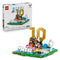 LEGO Lionel Messi soccer set with white glossy cardboard packaging and colorful plastic brick display, featuring gold number 10 highlights scene, goal frame and branded artwork on a studio background.