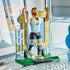 LEGO Lionel Messi soccer display features light blue, white, black, gold and green plastic brick construction showing the football icon with raised arms, number 10 backdrop and ball in a room setting.