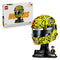 LEGO McLaren Formula 1 helmet collectible features bright yellow, orange and black plastic panels forming a detailed Lando Norris racing helmet display with minifigure and branded stand on a clean studio background.