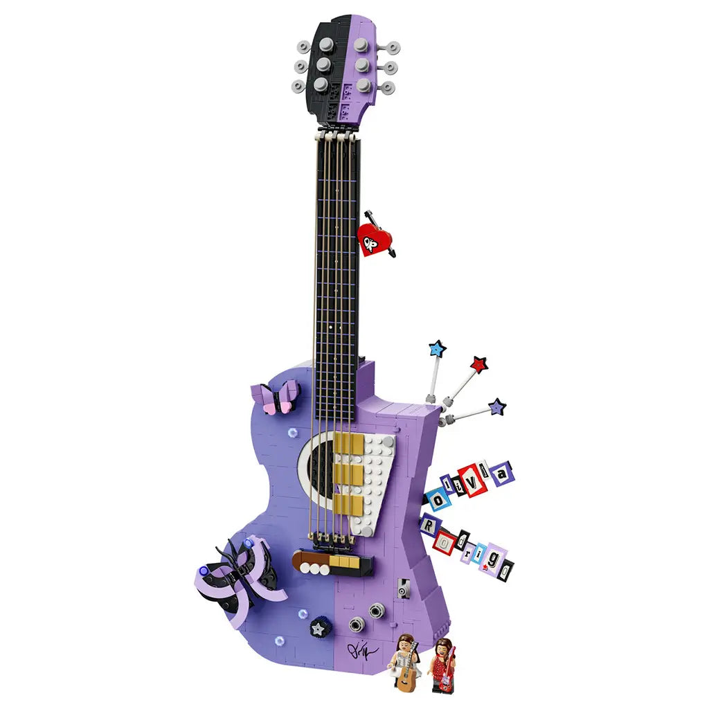 LEGO Editions Olivia Rodrigo's Dual Guitar in lavender, black and white bricks forms a tall guitar display with strings, butterfly, star details and two minifigures.