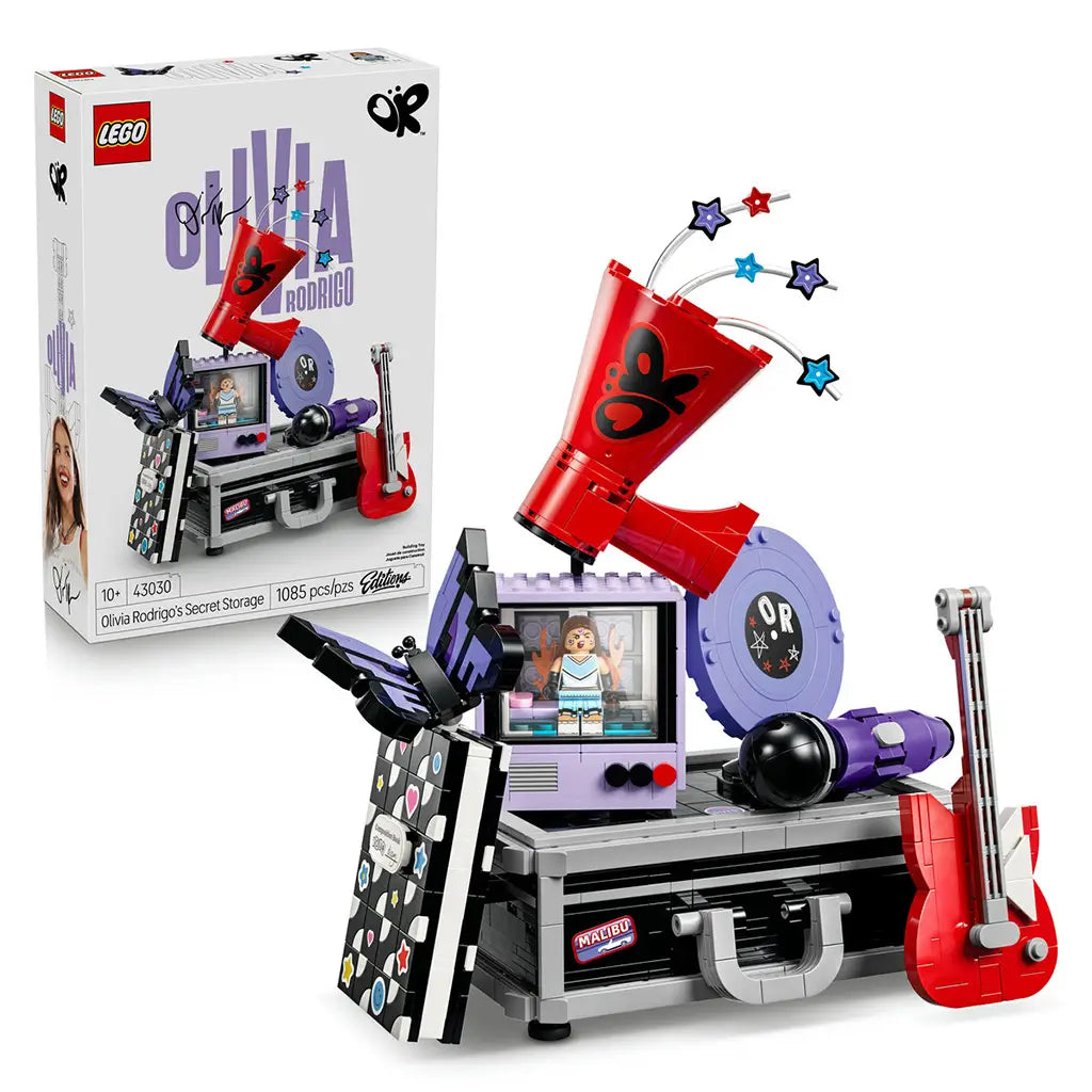 LEGO Olivia Rodrigo Secret Storage set pairs its white retail box with a black and gray music case display featuring a red guitar, lavender record and megaphone.