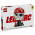 LEGO Ferrari Charles Leclerc helmet set packaging features red, white and black glossy plastic brick construction of a Formula 1 racing helmet on a display stand with minifigure, logos and collector branding.