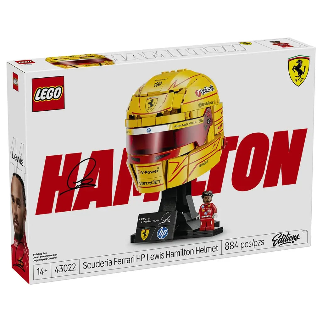 LEGO Ferrari Formula 1 helmet collectible features metallic yellow and red plastic panels forming Lewis Hamilton’s racing helmet, displayed with a branded stand and Ferrari minifigure on premium retail packaging.