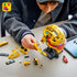 LEGO Ferrari Formula 1 helmet model features metallic yellow and red plastic panels with racing graphics, a tinted visor and Lewis Hamilton Ferrari minifigure displayed on a stand in a modern room.
