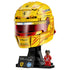 LEGO Ferrari Formula 1 helmet model features metallic yellow and red plastic sections with a tinted visor, sponsor graphics, display stand and Lewis Hamilton Ferrari minifigure against a studio background.