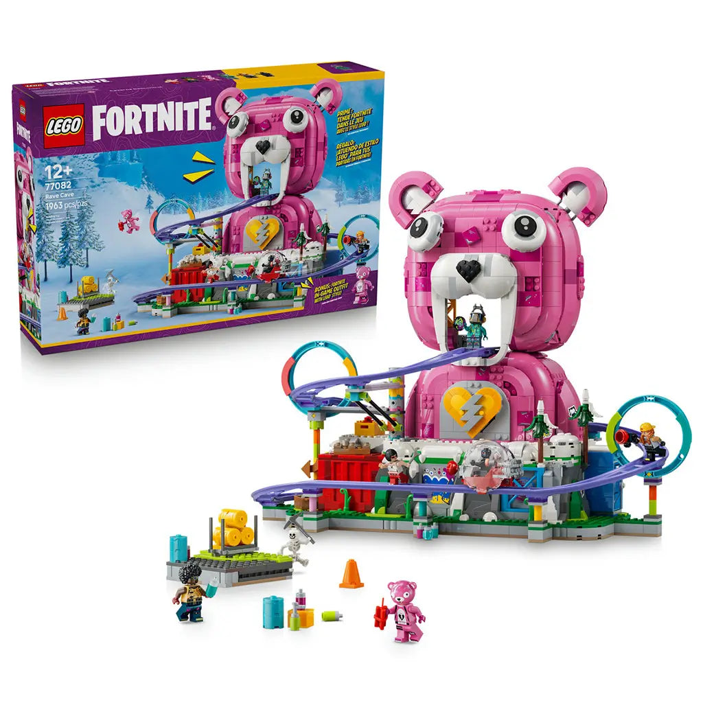LEGO Fortnite Rave Cave set 77082 in pink, white and purple plastic bricks, with bear-shaped venue, looping rail track, minifigures and accessories beside the retail box.