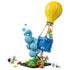 LEGO Fortnite Supply Drop set in yellow, blue and turquoise plastic bricks, featuring a balloon crate, bubble effect, green terrain base, three figures and small accessories.