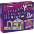 LEGO Friends Animal Vet Clinic back-of-box packaging, purple cardboard panel showing included minidolls, animals, tools, clinic layout, and step-by-step learn-to-build features illustrated clearly for young builders.
