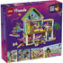 LEGO Friends Beach House with Seals back-of-box packaging, purple cardboard panel showing included minidolls, seals, accessories, interior rooms, and modular build details with play features illustrated on a colorful background.