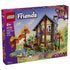 LEGO Friends Cozy Fall Forest Cabin set 42705 box front shows the brown cabin, purple roof, orange autumn trees, rocky stream, figures and bicycle, labeled 1229 pieces for ages 9+.