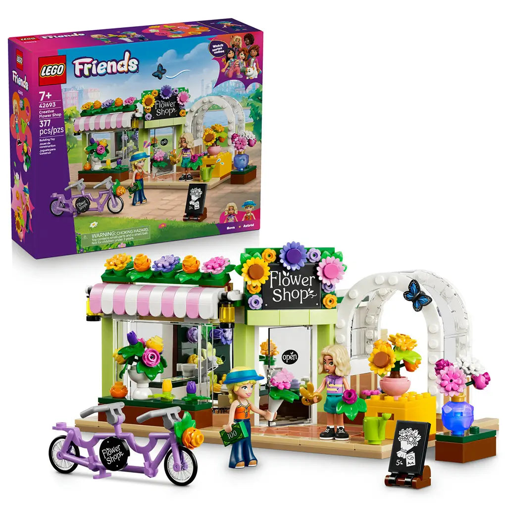 LEGO Friends Creative Flower Shop 42693 in green, pink and white plastic, with two mini-dolls, tandem bicycle, colorful flowers and retail box on a white background.