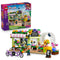 LEGO Friends Creative Flower Shop 42693 in green, pink and white plastic, with two mini-dolls, tandem bicycle, colorful flowers and retail box on a white background.