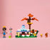LEGO Friends Forest Tea Party set in green, brown and pastel plastic, with two mini-dolls, squirrel, frog, tea table and autumn tree displayed on a pink background.