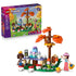 LEGO Friends Forest Tea Party 42690 in green, brown and orange plastic, with two mini-dolls, squirrel, frog, tea table, mushroom seats and retail box on white.
