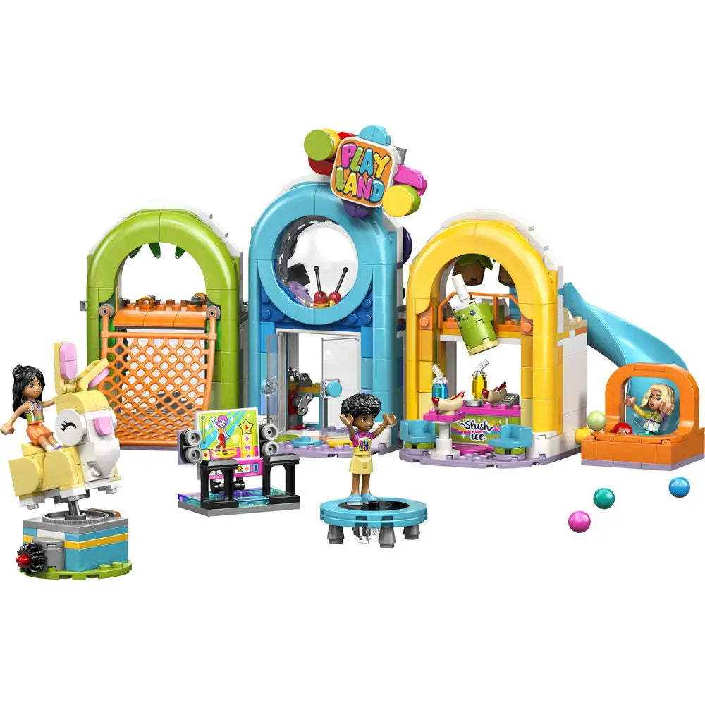 LEGO Friends indoor playground playset showing bright green, blue, and yellow plastic arches forming a Playland area with slide, trampoline, snack stand, bunny ride, and minifigures for active pretend play.