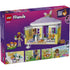 LEGO Friends box back view showing interior play features of the bunny hotel, including animal sleeping areas, feeding accessories, garden elements, minifigures, and illustrated play ideas.