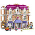LEGO Friends Heartlake City Grand Hotel set features a pink, white and lavender three-story facade with arched entry, balconies, working elevator, figures, luggage cart and wedding scene.