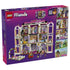 LEGO Friends Heartlake City Grand Hotel set 42704 box back shows the pink, white and lavender hotel interior with guest rooms, figures, elevator, luggage cart and play features.