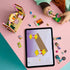 LEGO Friends Nature Glamping Cabin build in pink and brown plastic, with a child assembling flower scenery beside loose pieces and digital instructions on a tablet.