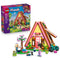 LEGO Friends Nature Glamping Cabin 42682 in pink, yellow and brown plastic, with A-frame cabin, two mini-dolls, black cat, teal bike, flower tree and retail box.