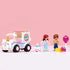 LEGO Friends Unicorn Cake Delivery Car set displayed in a row features pastel purple truck, unicorn face front, mini-doll characters, cake stand, gift box, and lollipop accessory arranged neatly against a light pink studio background.