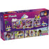 LEGO Friends box back view showing interior café features including dessert counters, seating areas, unicorn themed decorations, accessories, minifigures, and illustrated play functions inside the pastel building.