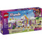 LEGO Friends Unicorn Dream Café box front featuring a purple package with illustrated unicorn café, rainbow entrance, dessert displays, tables, and minifigures, highlighting a magical building toy for kids ages six and up.
