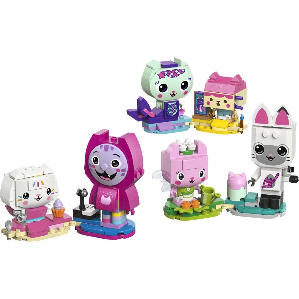 LEGO Gabby’s Dollhouse brick-built cat friends feature pastel pink, white, mint, and purple plastic characters with smooth rounded shapes, designed as playful collectible figures displayed together on a white background.