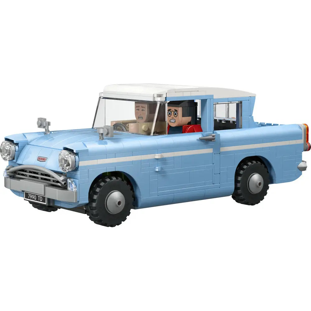 LEGO Harry Potter Enchanted Flying Ford Anglia model in light blue plastic with smooth brick texture, boxy vintage car shape, white roof, and minifigures inside, designed for magical display or imaginative play on a white background.
