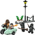 LEGO Harry Potter Hagrid’s Motorbike Escape scene shows multicolor plastic minifigures with smooth molded textures, featuring Hagrid riding a pale green motorbike with sidecar as Harry Potter casts spells during a nighttime street chase.
