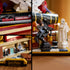 Detailed LEGO Harry Potter Philosopher’s Stone scene in white, brown, and gold plastic showing interior book compartments, sculpted statues, minifigure moments, and intricate decorative elements designed for premium collectible display.