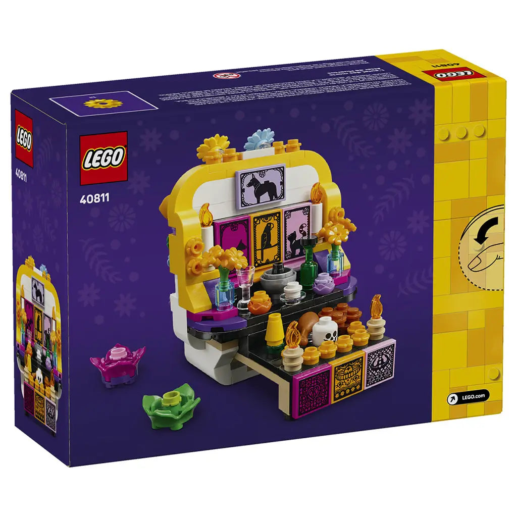 LEGO Altar of the Dead 40811 package back shows the opened white and yellow skull altar with colorful framed art, flowers, candles, bottles, and food offerings.