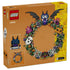 LEGO Halloween Wreath 40825 package back shows the green brick wreath with black bat, white ghost, orange pumpkin, purple flowers, spiderwebs, dimensions, and detail insets.