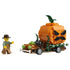 LEGO Jack-O'-Lantern Pickup Truck in brown and orange plastic bricks features a large angry pumpkin, green vines, black spider, bone bumper, and farmer minifigure on white.