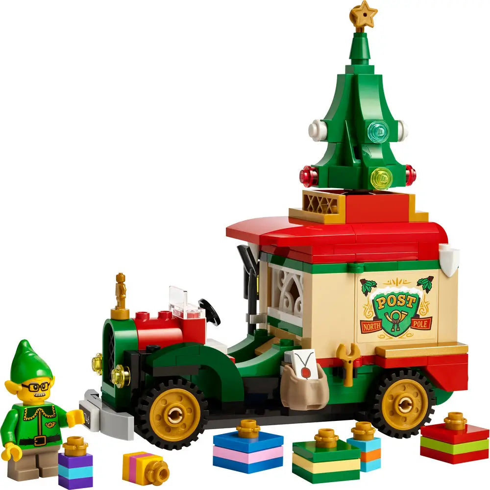 LEGO Santa’s Delivery Truck set featuring a festive red, green, and gold mail truck with a Christmas tree topper, colorful presents, and an elf minifigure wearing glasses.