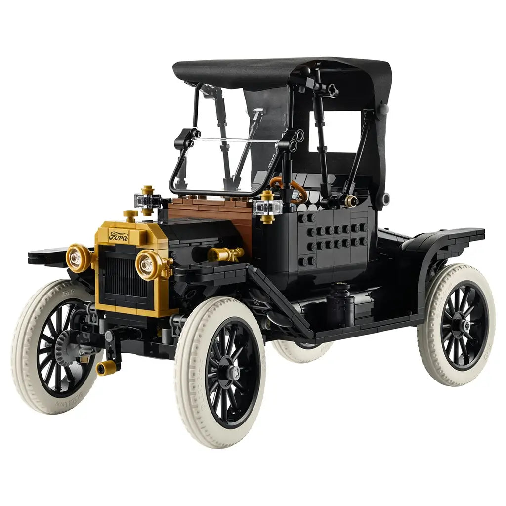 LEGO Ford Model T model features black plastic body with gold accents, white tires, and spoked wheels forming a vintage car replica, designed as a detailed collectible automobile displayed against a clean white background.