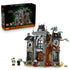 LEGO Icons Mayor Manor set 11383 features a gray and brown plastic gothic mansion with stained-glass windows, twisting tree, three minifigures, cat and rat on white.