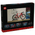 LEGO Icons Road Bike package back in black and red shows the completed brick-built bicycle displayed on a shelf, with smaller panels highlighting model details and scale.