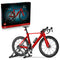 LEGO Icons Road Bike set pairs a red and black brick-built racing bicycle with its product box, showing drop bars, deep wheels and gray stand on a white background.