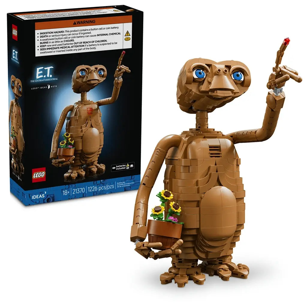 LEGO Ideas E.T. set 21370 pairs its black box with the brown brick-built alien, featuring bright blue eyes, a flowerpot of sunflowers and raised glowing fingertip.