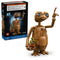 LEGO Ideas E.T. set 21370 pairs its black box with the brown brick-built alien, featuring bright blue eyes, a flowerpot of sunflowers and raised glowing fingertip.