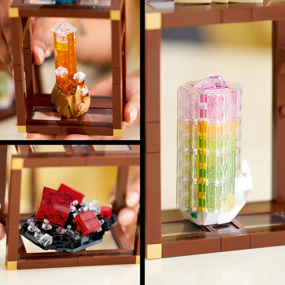 Detailed close-up of LEGO Ideas Mineral Collection showing vibrant orange, red, and rainbow-colored crystal formations built from translucent LEGO pieces on brown display stands.