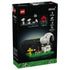 LEGO Ideas Snoopy's Doghouse box back shows white Snoopy and yellow Woodstock on a green brick base, with alternate Snoopy poses, campfire scene and doghouse feature.