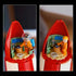 LEGO Ideas Tintin Moon Rocket playset features a red and white plastic rocket control room with an orange astronaut minifigure, dashboard details and cockpit interior displayed in close-up.